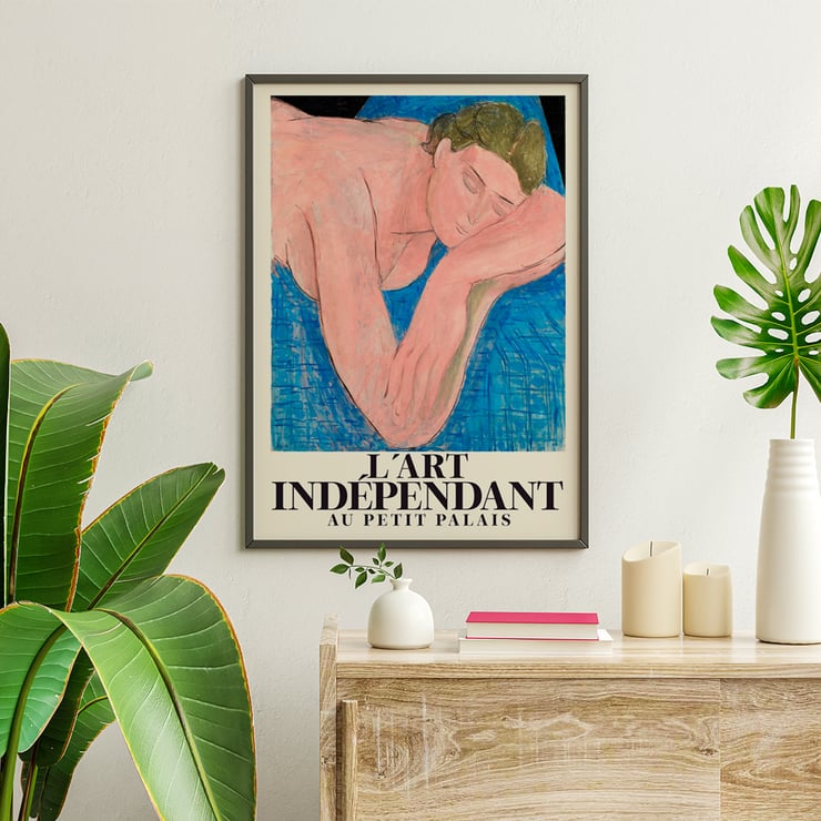 Poster featuring Le rêve by Henri Matisse at Petit Palais art exhibition Poster featuring a reclining figure with closed eyes on a blue background by Henri Matisse titled Le rêve.