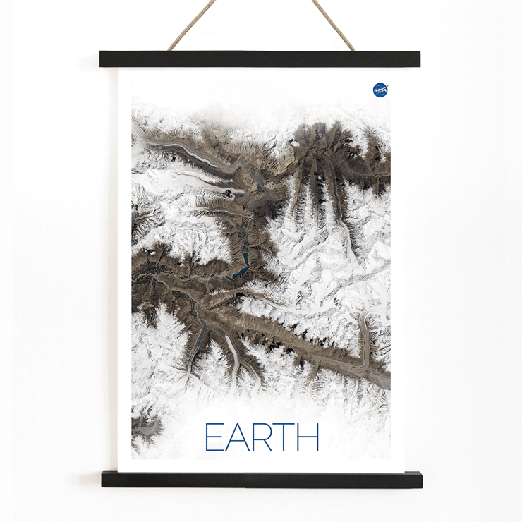 A stunning view of Earth's snowy mountain ranges by NASA from the artwork Earth 1 Poster titled Earth by NASA depicting a detailed and high-resolution satellite image of rugged terrain with snow-covered peaks
