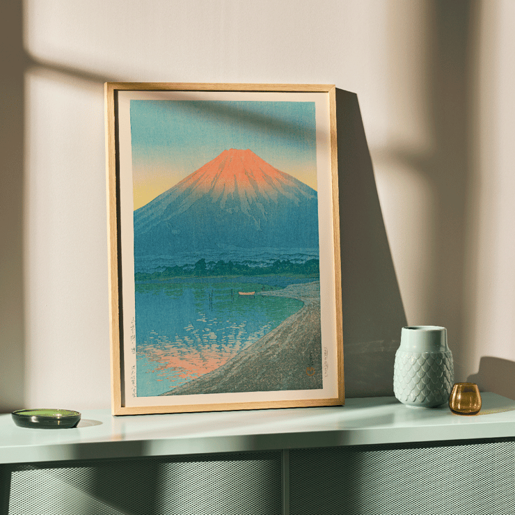 Serene sunrise over Lake Yamanaka with Mount Fuji by Kawase Hasui Poster of Daybreak over Lake Yamanaka by Kawase Hasui depicting a serene lake with Mount Fuji in the background at dawn.