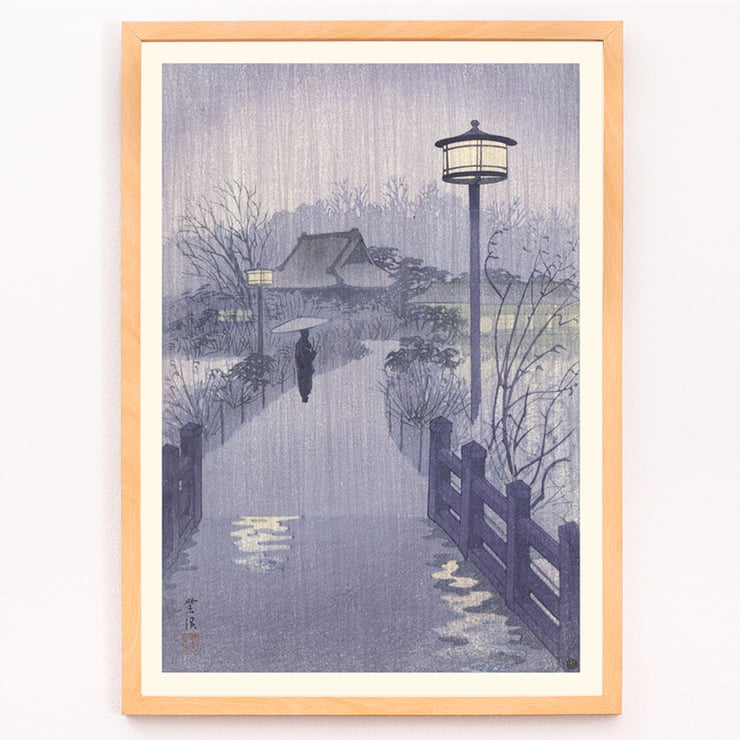 Illustration of a rainy evening at Shinobazu pond by Kasamatsu Shirô showing a person with an umbrella walking near a lamppost. Poster of a serene evening scene with a lone figure by Shinobazu pond Artist Kasamatsu Shirô Artwork Evening rain