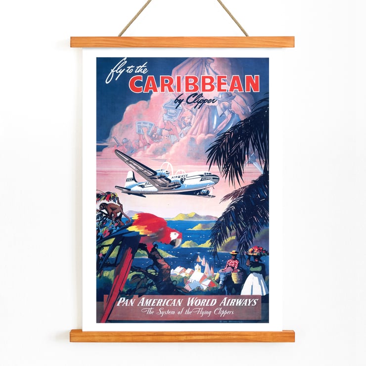 Fly to the Caribbean by Clipper artwork by Mark Von Arenburg depicting Pan American World Airways plane. Poster of Pan American World Airways promoting Caribbean flights by clipper showcasing vibrant tropical scenery by Mark Von Arenburg.