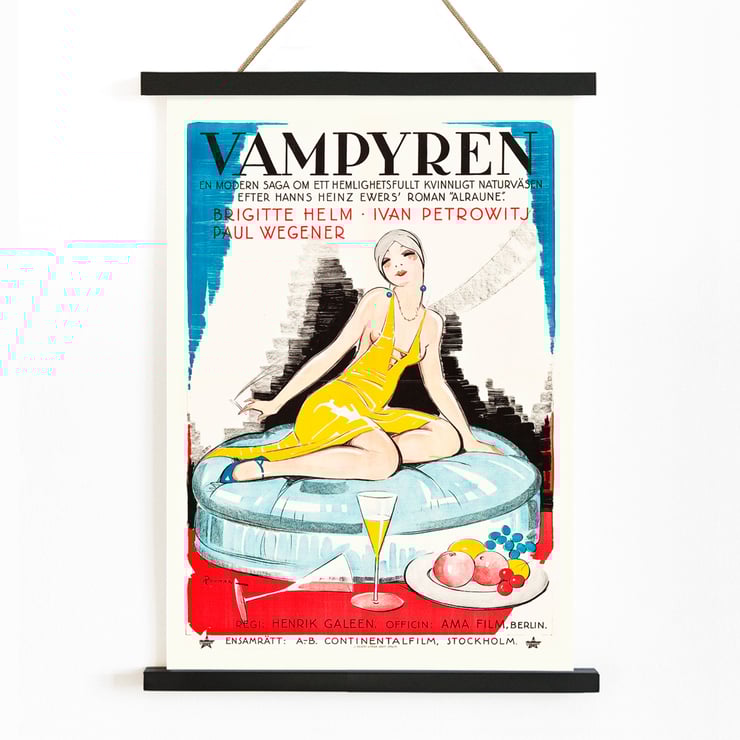Poster of Vampyren featuring a woman in a yellow dress with A Daughter of Destiny by Eric Rohman. Poster titled A Daughter of Destiny by Eric Rohman features a stylish woman in a yellow dress sitting on a circular seat.
