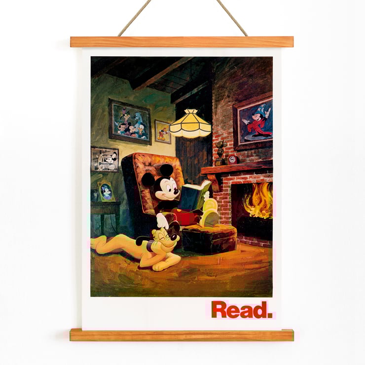 Mickey Mouse reading by the fireplace Read by American Library Association U.S. Information Agency Poster featuring Mickey Mouse reading by the fireplace with Pluto titled Read American Library Association by US Information Agency