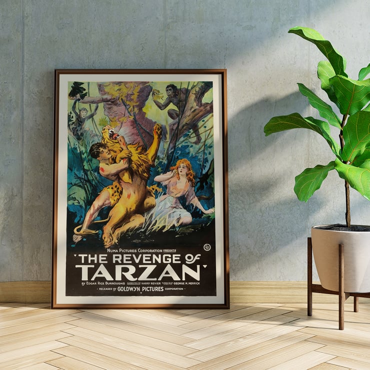 Poster art by Harry Revier featuring a dramatic jungle scene from The Revenge of Tarzan. Poster for The Revenge of Tarzan featuring jungle scene with Tarzan wrestling a lion and a woman watching with fright.
