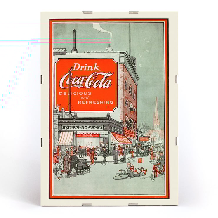 Drink Coca Cola vintage advertisement depicting a busy street scene Poster titled Drink Coca Cola showing a bustling street scene with people near a pharmacy and a large Coca Cola billboard