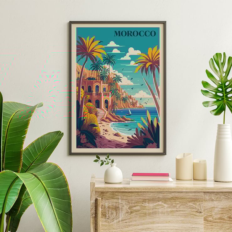 Colorful coastal landscape with palm trees from the artwork Morocco Travel Poster by the artist. Morocco Travel Poster featuring a vibrant coastal landscape with palm trees and a Mediterranean style building by the sea