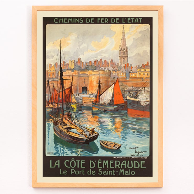 Colorful vintage travel poster of Saint-Malo harbor by artist Mourgue titled La côte d’Émeraude Le Port de Saint-Malo. Poster of La côte d’Émeraude Le Port de Saint-Malo by Maurice Toussaint featuring sailing boats in a vibrant harbor scene