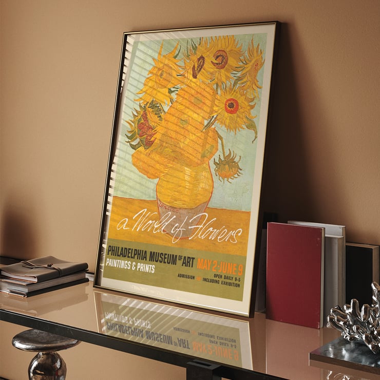Painting A World of Flowers features a vibrant bouquet Poster for an art exhibition featuring a vase of sunflowers with the title A World of Flowers at the Philadelphia Museum of Art.
