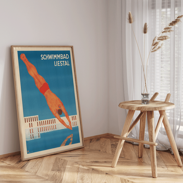Schwimmbad Liestal by artist featuring a man diving into a pool Poster of Schwimmbad Liestal depicting a diver in mid-air above a pool with a modern building in the background.