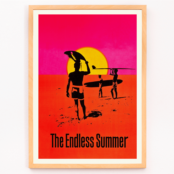 The Endless Summer surfers walking on beach at sunset Poster featuring surfers carrying boards against a stylized sunset backdrop titled The Endless Summer