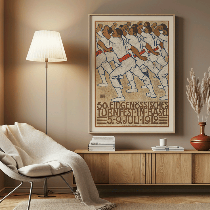 Federal Gymnastics Festival in Basel by Eduard Renggli depicts a group of male gymnasts dressed in white uniforms performing synchronized movements. Poster of athletes in white uniforms with red sashes in a formation by Eduard Renggli titled Federal Gymnastics Festival in Basel.