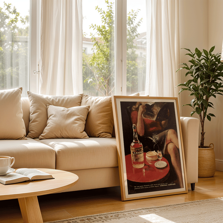 Cordial Campari Vintage poster by artist Miroglio featuring a woman relaxing with a drink and magazine. Cordial Campari Vintage poster by Nizzoli featuring a seated woman with a magazine and a bottle on a table.