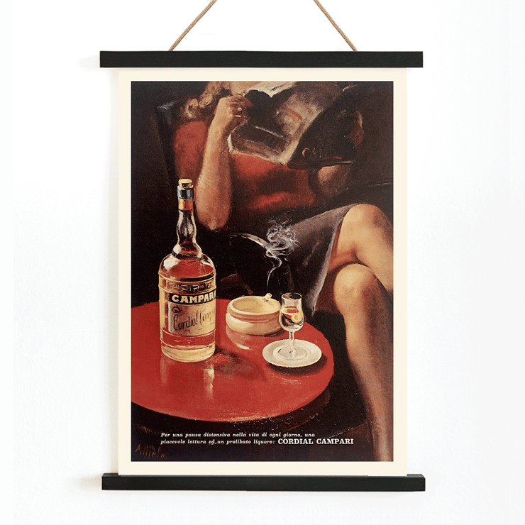 Cordial Campari Vintage poster by artist Miroglio featuring a woman relaxing with a drink and magazine. Cordial Campari Vintage poster by Nizzoli featuring a seated woman with a magazine and a bottle on a table.