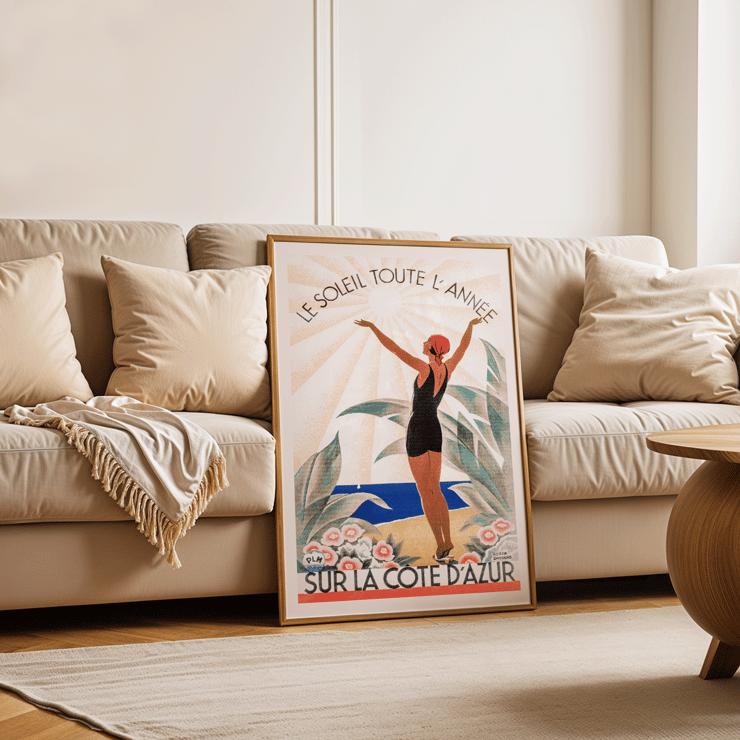 Woman enjoying sunny beach scenery Cote d'Azur by Roger Broders. Poster of a woman in a swimsuit with arms raised at the beach surrounded by flowers Artwork Cote d'Azur by Roger Broders