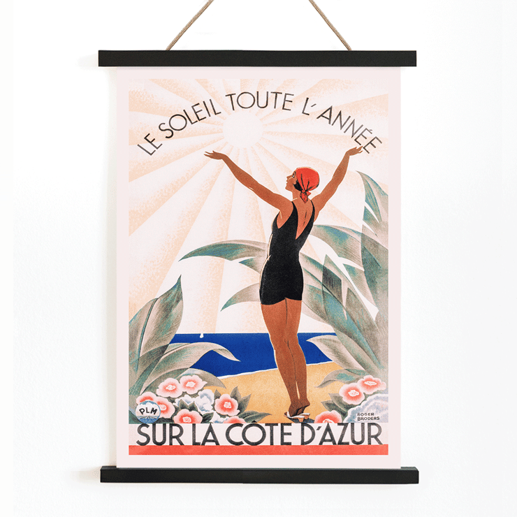 Woman enjoying sunny beach scenery Cote d'Azur by Roger Broders. Poster of a woman in a swimsuit with arms raised at the beach surrounded by flowers Artwork Cote d'Azur by Roger Broders