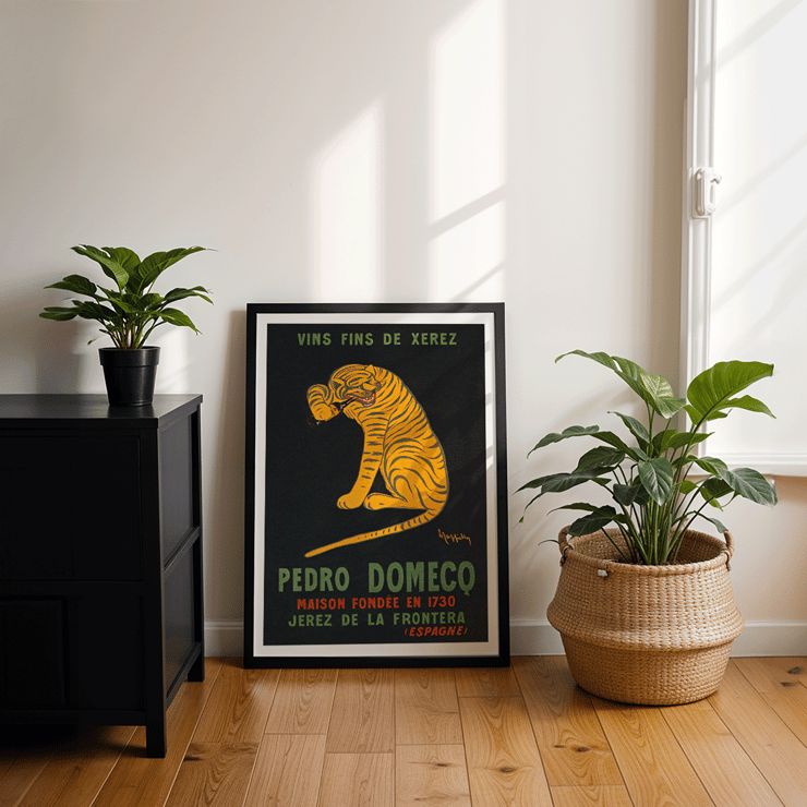 Leonetto Cappiello depicts a playful tiger for Xerez Pedro Domeco advertisement. Poster titled Xerez Pedro Domeco by Leonetto Cappiello featuring a tiger on a black background promoting Pedro Domecq wine.