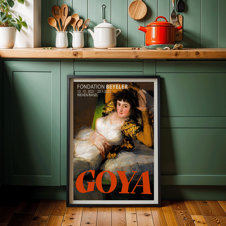The Clothed Maja exhibition poster by Francisco Goya featuring a reclining woman in a white dress with yellow sleeves The Clothed Maja exhibition poster by Francisco Goya at Fondation Beyeler featuring the reclining woman in white and gold attire