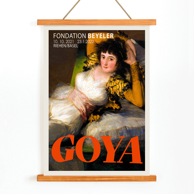 The Clothed Maja exhibition poster by Francisco Goya featuring a reclining woman in a white dress with yellow sleeves The Clothed Maja exhibition poster by Francisco Goya at Fondation Beyeler featuring the reclining woman in white and gold attire