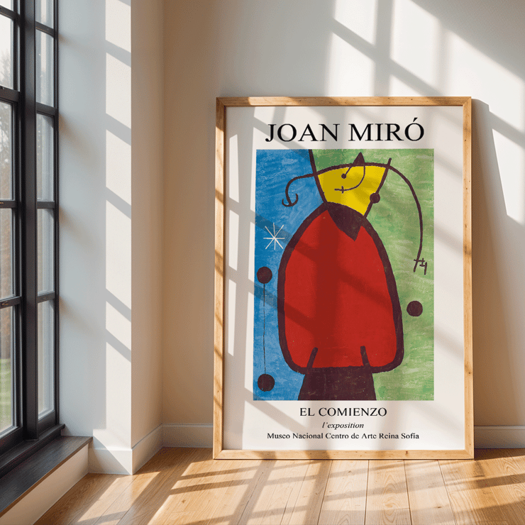 Exhibition poster featuring El Comienzo by Joan Miro with colorful abstract design. El Comienzo exhibition poster inspired by Joan Miro featuring abstract shapes and vibrant colors in a framed display