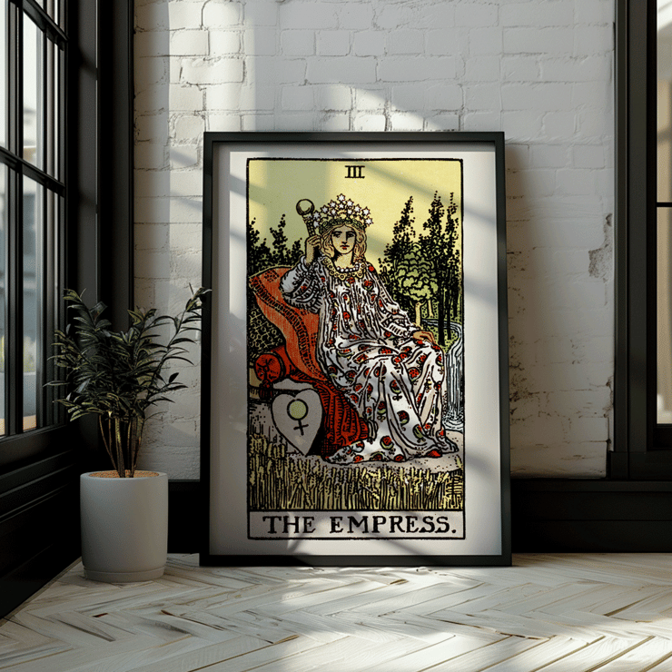 Colorful Tarot card The Empress by Rider Waite featuring a crowned woman sitting on a throne in a lush natural setting. Poster of Tarot - The Empress by Rider Waite showing a woman seated on a throne with a crown of stars, holding a scepter.