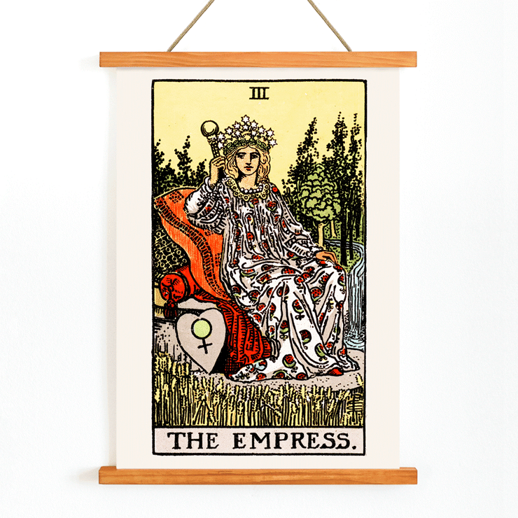 Colorful Tarot card The Empress by Rider Waite featuring a crowned woman sitting on a throne in a lush natural setting. Poster of Tarot - The Empress by Rider Waite showing a woman seated on a throne with a crown of stars, holding a scepter.