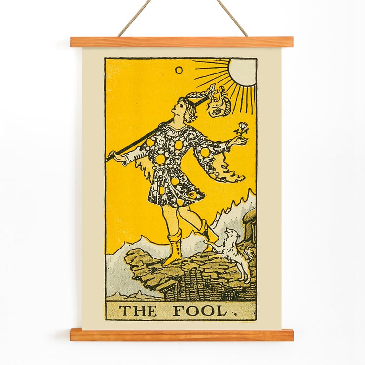 The Fool tarot card illustration by Lauron William de Laurence featuring a whimsical character and a small dog on a cliff. The Fool tarot card poster by Lauron William de Laurence depicts a figure on a cliff with a dog beneath a bright yellow background.