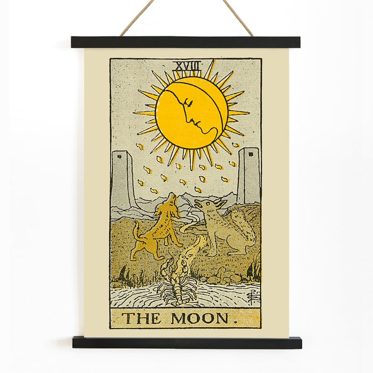 The Moon tarot card featuring sun and animals from The Illustrated Key to the Tarot by Lauron William de Laurence Poster of The Moon by Lauron William de Laurence featuring a tarot card with dogs howling at a moon with a face.