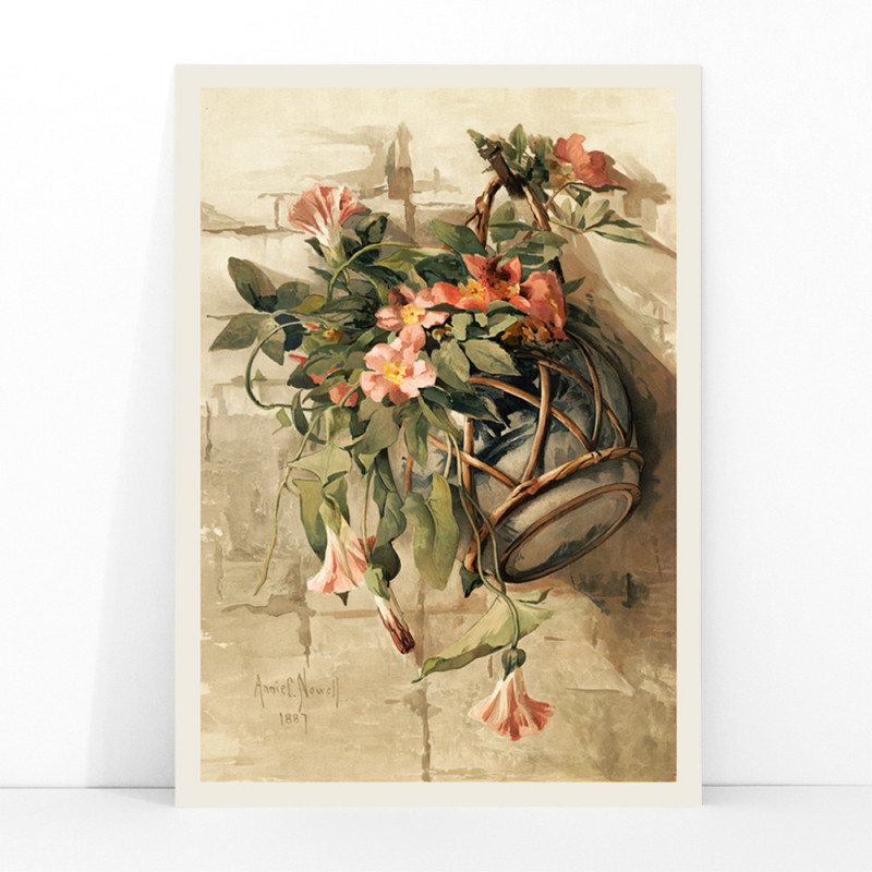 Fleurs roses dans un vase suspendu