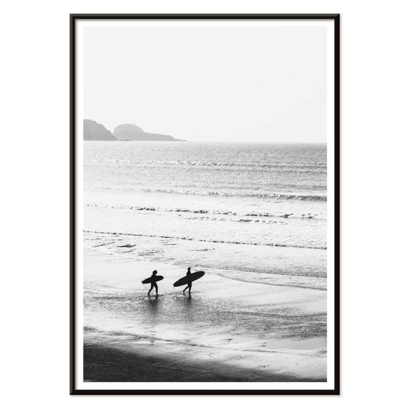 Surfers walking on the beach