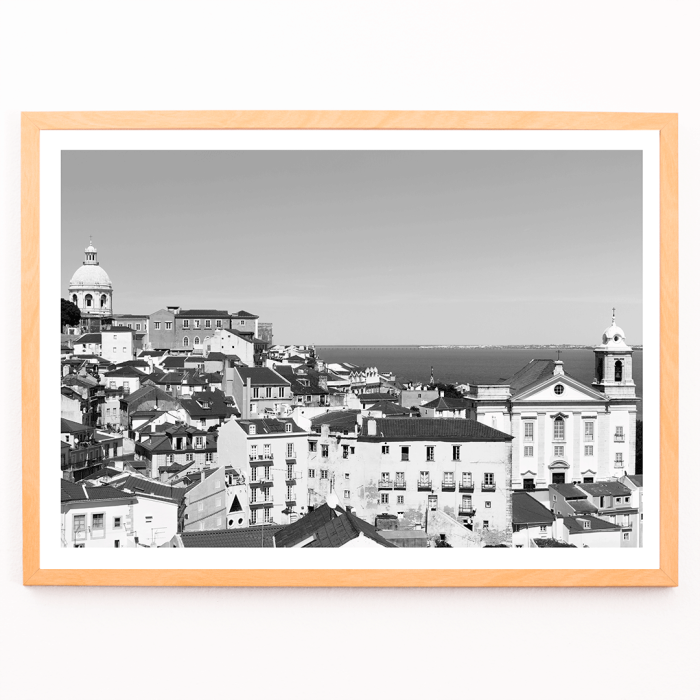 Poster featuring a black and white landscape of Lisbon's old city with rooftops and historic buildings titled Lisbon Old City Landscape