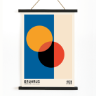 Bauhaus Poster 17 features intersecting circles in orange red black on blue and beige background framed with text at the bottom