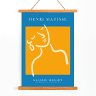 Henri Matisse poster featuring abstract artwork of a girl with an earring in orange and blue displayed at Galerie Maeght.