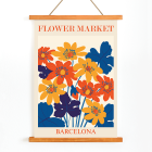 Poster of vibrant orange yellow and blue flowers with text Flower Market Barcelona by artist Moryarty displayed at the top and bottom