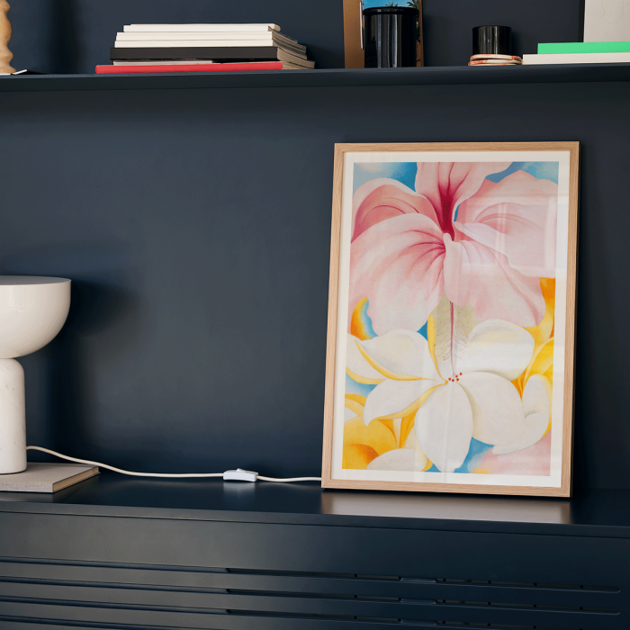 Poster of Hibiscus with Plumeria by Georgia O’Keeffe featuring vibrant pink and white flowers with a colorful background