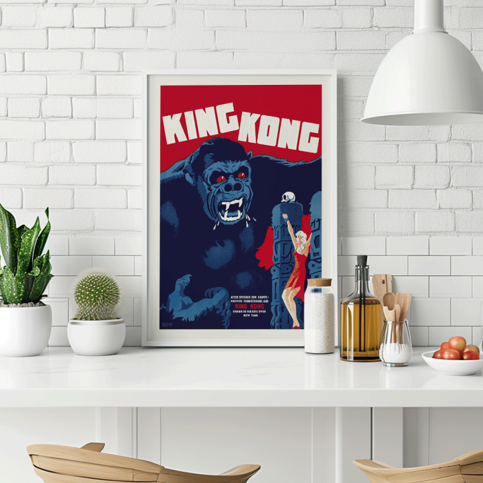 King Kong movie poster by Boye featuring a giant gorilla with red eyes grabbing a building with a woman in a red dress holding her hand up