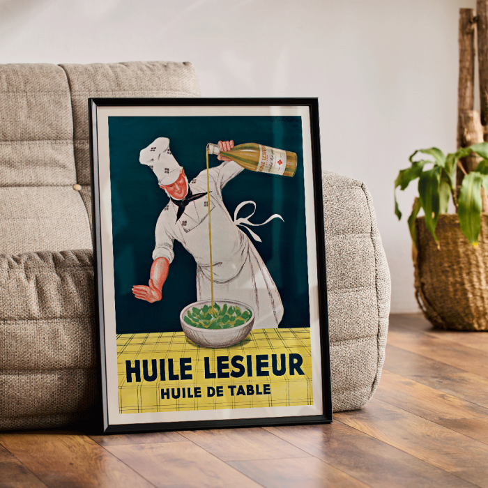 Poster featuring a chef pouring oil from a bottle into a bowl of salad Huile Lesieur by Leonetto Cappiello.